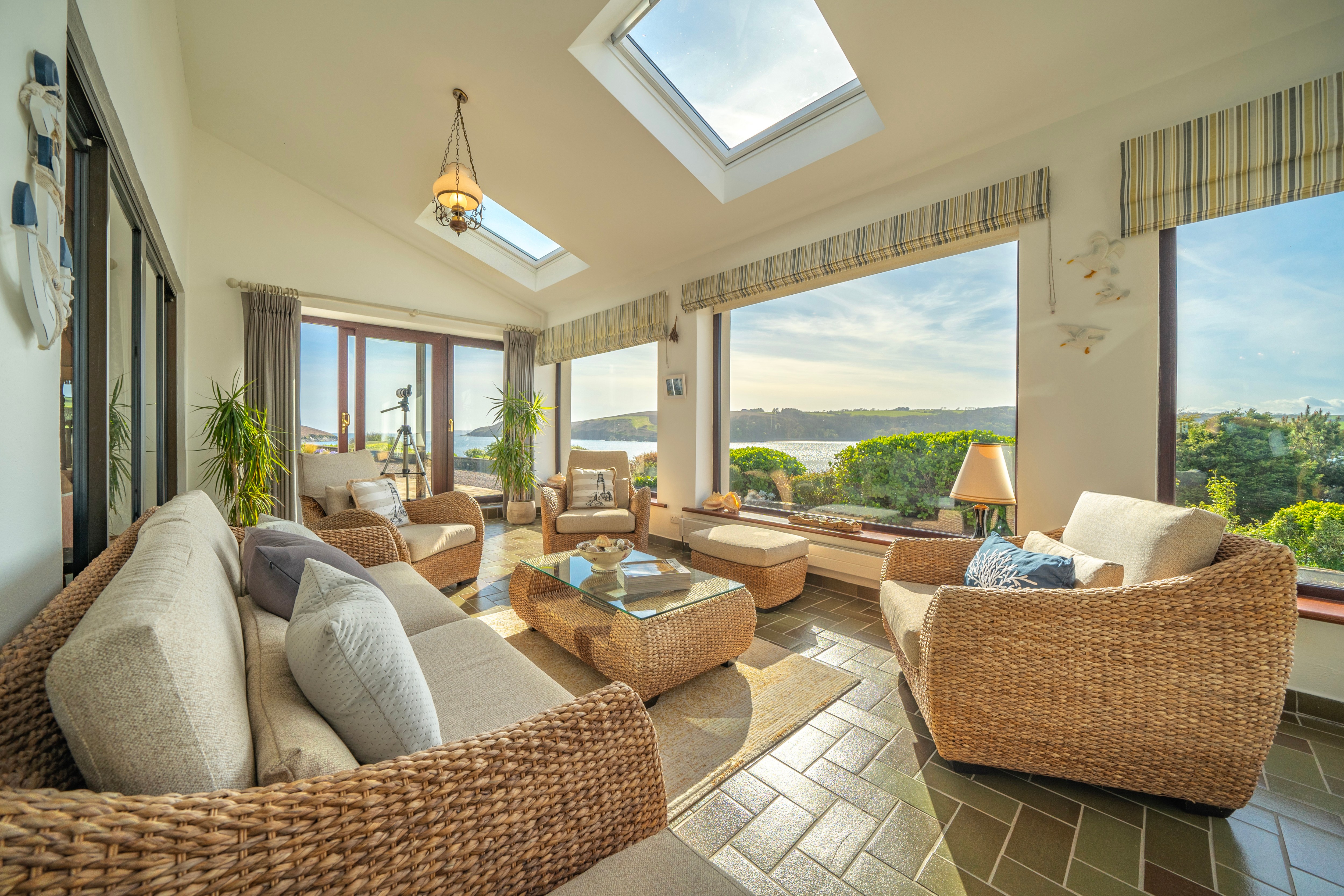 Floor-to-ceiling windows reveal sweeping sea views at this €2.4 million waterfront home near Kinsale