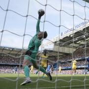 Crystal Palace goalkeeper Dean Henderson saves from Chelsea's Cole Palmer during the Premier League match at Stamford Bridge, London. Picture date: Sunday September 1, 2024.