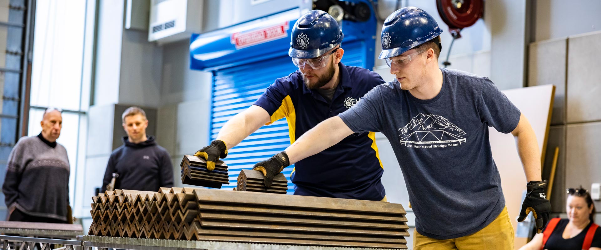 UAF College of Engineering and Mines students compete in the 2022 Steel Bridge Competition at the ELIF Building High Bay.