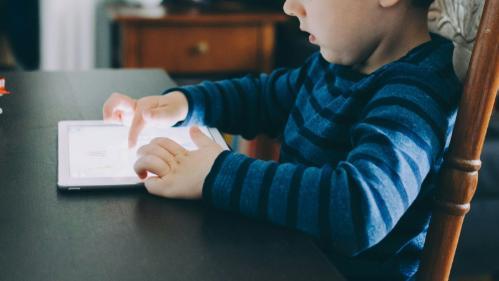 A small child using an ipad