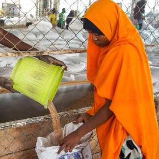 Halima, receiving her wheat grain ration at Kakuma 3 food distribution point