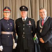 Simon Griffiths (centre with the Lord Lieutenant of Shropshire, Anna Turner and mayor of Whitchurch, Councillor Andy Hall) has served the town for 44 years.