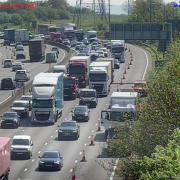 A white Mitsubishi Fuso Canter van and a white Scania tractor were involved in the M25 collision.