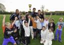 Yorkshire trio Jack Leaning, Will Rhodes and Matt Fisher with the County Championship trophy and some of the junior members at Civil Service Cricket Club