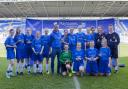 Woldgate College’s Under-15 footballers with England star Andros Townsend after their 3-2 defeat by Didcot Girls’ School in the final of the English Schools’ FA PlayStation U15 Schools’ Cup for Girls at the Madejski Stadium