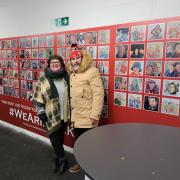 Artist Sue Clayton and Y Front magazine's Michael Miles in front of the display at the LNER Community Stadium.