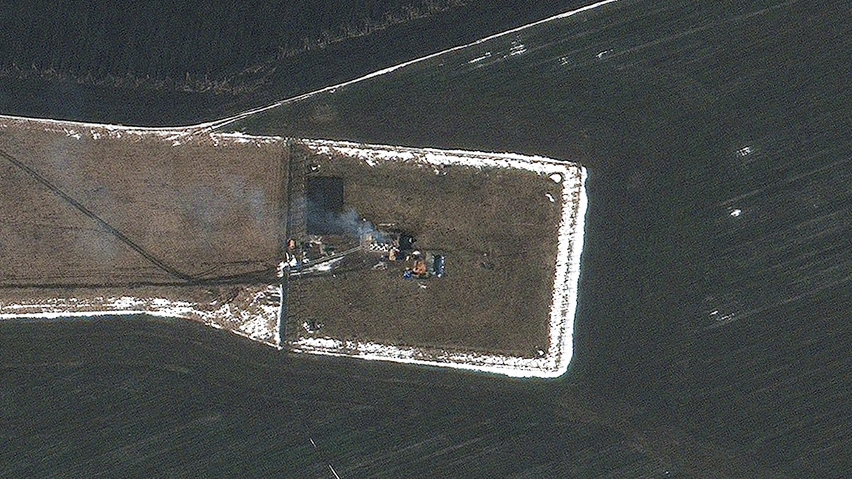 A satellite image shows damage to fuel storage areas and other airport infrastructure at the Chuhuiv airfield in the eastern Ukrainian city of Chuhuiv, in Kharkiv region, Ukraine February 24, 2022. Courtesy of Satellite image 2022 Maxar Technologies/Handout via REUTERS ATTENTION EDITORS - THIS IMAGE HAS BEEN SUPPLIED BY A THIRD PARTY. NO RESALES. NO ARCHIVES. MANDATORY CREDIT. DO NOT OBSCURE LOGO.
