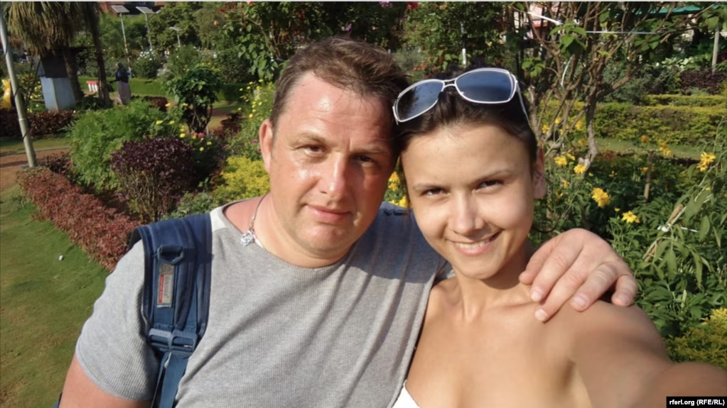 Vladyslav Yesypenko poses with his arm around his wife, Kateryna Yesypenko