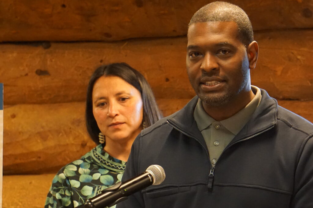 Environmental Protection Agency Director Michael Regan speaks at an Aug. 31, 2023 news conference held at the Alaska Native Heritage Center. Behind him is Kate Wolgemuth, program and government affairs manager for Voice of the Arctic Iñupiat. (Photo by Yereth Rosen/Alaska Beacon)