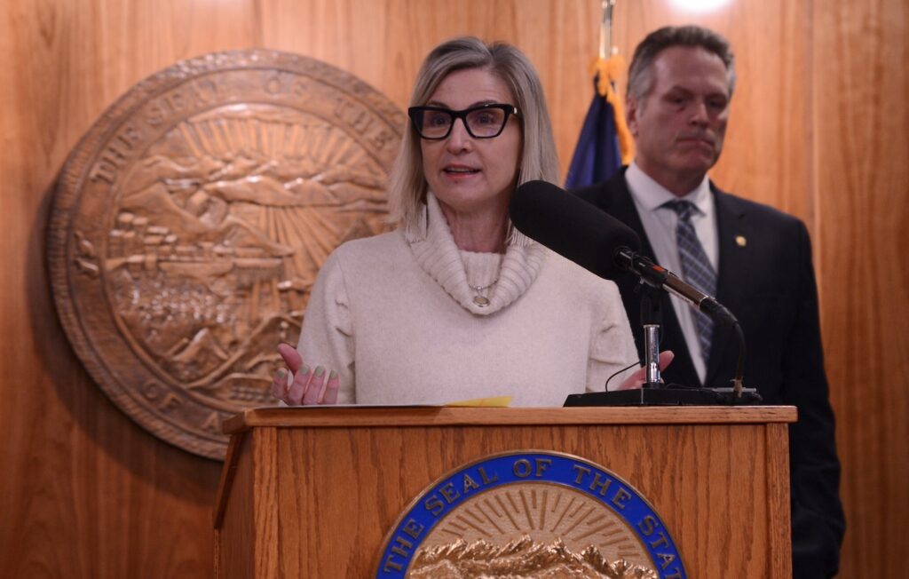 Deena Bishop, commissioner of the Alaska Department of Education and Early Development, speaks at a news conference Friday, March 15, 2024, with Gov. Mike Dunleavy. (Photo by James Brooks/Alaska Beacon)