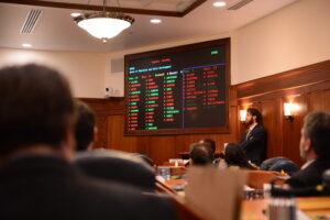 Members of the state House and Senate look at a tally board showing the failure of Bob Griffin to be confirmed to the Alaska state school board on Tuesday, May 7, 2024. (Photo by James Brooks/Alaska Beacon)