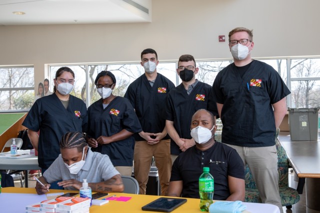 Members of  the Maryland Army National Guard pose for a photo during a vaccination clinic at the Board of Child Care's Residential Child Care center, March 16, 2022, in Windsor Mill, Maryland. Soldiers provided inoculations for residents and staff during a vaccination clinic supported by the Vaccine Equity Task Force, an initiative to promote equitable access to the COVID-19 vaccine throughout Maryland. (U.S. National Guard photo by Spc. Christina Chang)