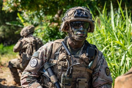 Two U.S. Army Soldiers, assigned to Charlie (Cold Steel) Company, 1st Battalion, 27th Infantry Regiment &#34;Wolfhounds,&#34; 2nd Infantry Brigade Combat Team, 25th Infantry Division, takes a knee while on their way to an objective for a Combined Arms Live Fire Exercise during Exercise Super Garuda Shield 2023, at the 5th Marine Combat Training Center, Puslatpur, Indonesia., Sept. 11, 2023.