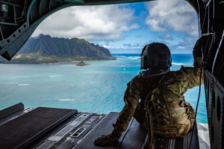 U.S. Army Sgt. Shelby Lewis, a flight engineer assigned to Company B, 2nd Battalion, 211th Aviation Regiment, 103rd Troop Command, Hawaii Army National Guard (HIARNG), conducts flight operations during a CH-47 Chinook flight for Recruit Sustainment Program (RSP) training at the Regional Training Institute, Waimanalo, Hawaii, March 3, 2024. The HIARNG RSP training primarily focuses on ensuring the RSP warrior is mentally prepared, administratively correct and physically ready to ship and complete basic training.