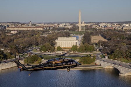 U.S. Army Capt. Chris Bissett and Warrant Officer Eric Mendoza, pilots, and U.S. Army Staff Sgt. Daniel Pechacek, crew chief, all assigned to Alpha Company, 12th Aviation Battalion, The Army Aviation Brigade, fly a VH-60M Black Hawk over the Potomac River near the National Mall, Washington, D.C., March 25, 2024. The 12th Aviation Battalion uses VH-60M &#34;gold top&#34; Black Hawks to conduct priority air transport in support of Department of the Army senior leadership and other senior Department of Defense officials. 