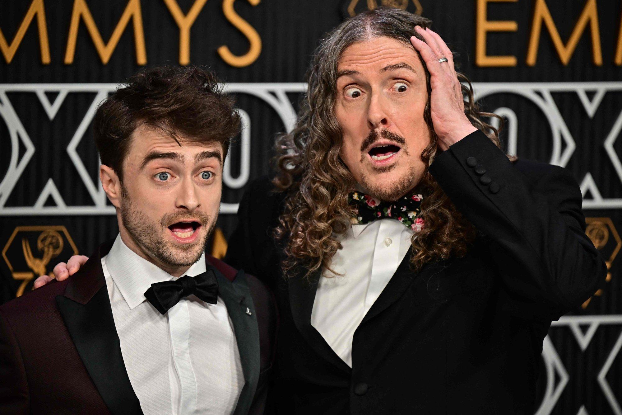British actor Daniel Radcliffe (L) and US musician Al Yankovic arrive for the 75th Emmy Awards at the Peacock Theatre at L.A. Live in Los Angeles on January 15, 2024. (Photo by Frederic J. Brown / AFP)