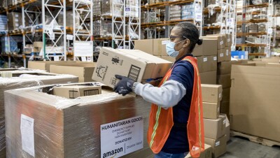 An Amazon employee prepares products for distribution at the Amazon Disaster Relief Hub in Atlanta, Georgia. 