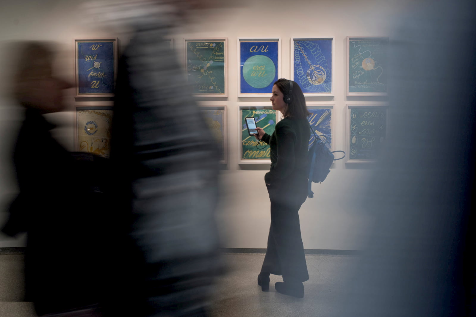 A visitor exploring an exhibition at The Solomon R. Guggenheim Museum using the free Bloomberg Connects mobile app.