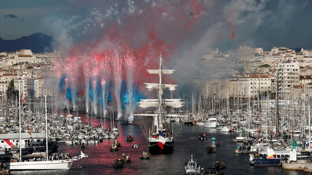 The Belem, a three-masted sailing ship carrying the Olympic flame, arrives at Marseille's Old Port in France ahead of the 2024 Paris Olympics, May 8, 2024. 
