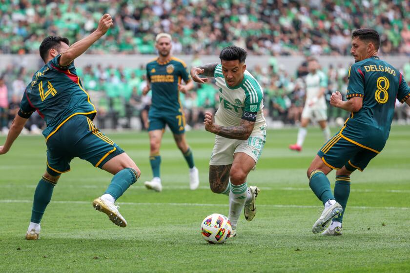 AUSTIN, TX - APRIL 27: Austin FC forward Sebastián Driussi (10) splits defenders Los Angeles Galaxy.