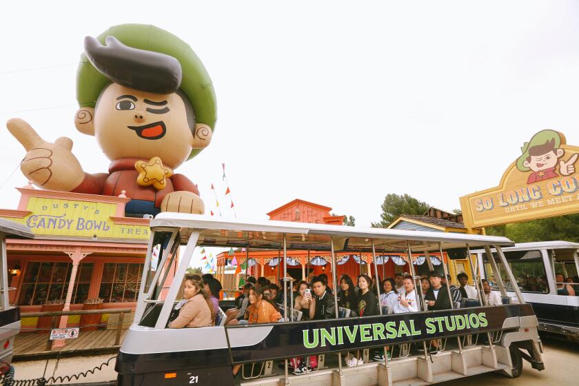 UNIVERSAL CITY, CA - MAY 25, 2023 - Visitors enter the set or Jupiter's Claim from the movie, "Nope," while taking the Universal Studios Tram Tour on May 25, 2023. (Genaro Molina / Los Angeles Times)