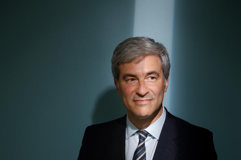 A man is photographed in the Los Angeles Times photo studio