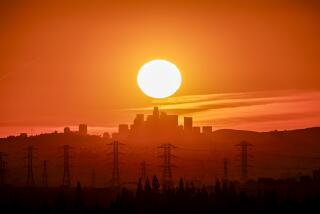 Azusa, CA, Friday, February 9, 2024 - The sun sets behind the LA skyline as seen from Azusa. (Robert Gauthier/Los Angeles Times)