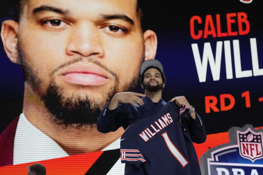 Southern California quarterback Caleb Williams celebrates after being chosen by the Chicago Bears with the first overall pick during the first round of the NFL football draft, Thursday, April 25, 2024, in Detroit. (AP Photo/Jeff Roberson)