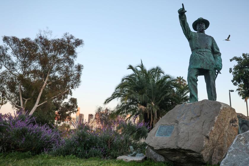 Los Angeles, CA - April 10: The now defaced statue of General Harrison Gray Otis, with a part of the statue now sawed off to the feet at MacArthur Park on Tuesday, April 9, 2024 in Los Angeles, CA. The Statue was designed by sculptor Paul Troubetzkoy in 1920 and dedicated in 1930. (Michael Blackshire / Los Angeles Times)