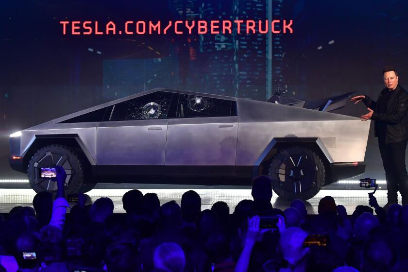 Tesla co-founder and CEO Elon Musk gestures while wrapping up his presentation of the newly unveiled all-electric battery-powered Tesla Cybertruck at Tesla Design Center in Hawthorne, California on November 21, 2019. (Photo by Frederic J. BROWN / AFP) (Photo by FREDERIC J. BROWN/AFP via Getty Images)