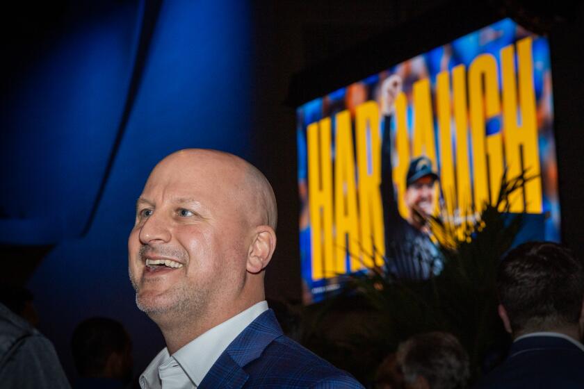 Chargers new general manager Joe Hortiz talks to a person following the introductory press conference of coach Jim Harbaugh.