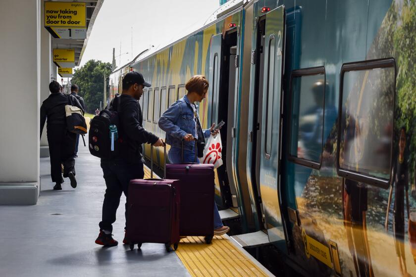 MIAMI, FLORIDA-Feb. 6, 2024-Passengers get onboard the train at the Brightline Fort Lauderdale Station in Fort Lauderdale, Florida, US, on Tuesday, February 6, 2024. (Eva Marie Uzcategui / Los Angeles Times)