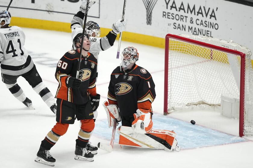 Los Angeles Kings center Trevor Lewis, second from right, celebrates a goal by defenseman Matt Roy.