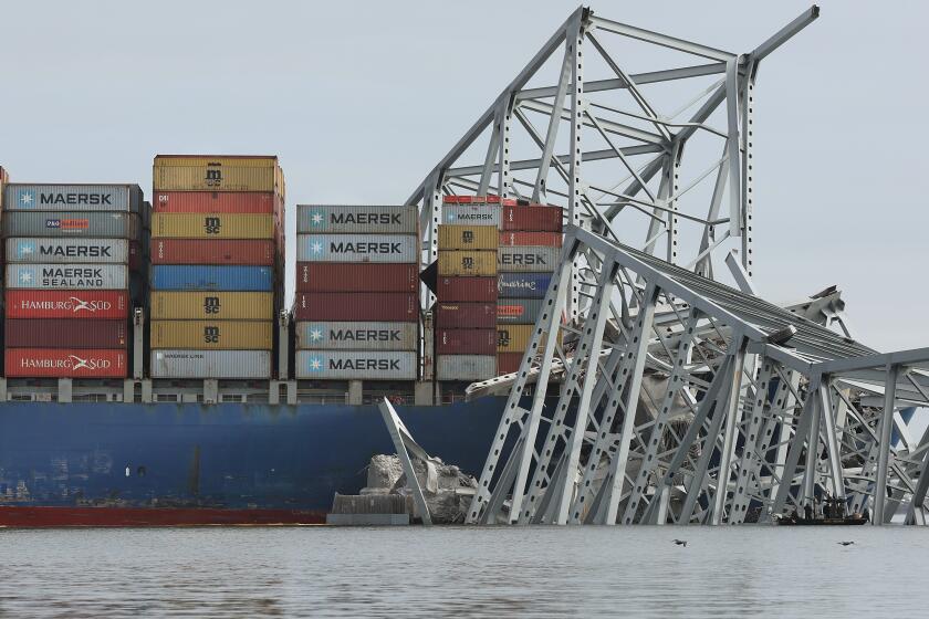 BALTIMORE, MARYLAND - MARCH 26: The cargo ship Dali sits in the water after running into and collapsing the Francis Scott Key Bridge on March 26, 2024 in Baltimore, Maryland. According to reports, rescuers are still searching for multiple people, while two survivors have been pulled from the Patapsco River. A work crew was fixing potholes on the bridge, which is used by roughly 30,000 people each day, when the ship struck at around 1:30am on Tuesday morning. The accident has temporarily closed the Port of Baltimore, one of the largest and busiest on the East Coast of the U.S. (Photo by Kevin Dietsch/Getty Images)