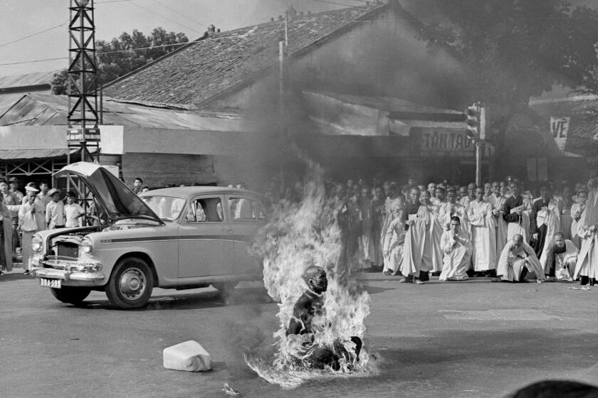 EDS NOTE: GRAPHIC CONTENT - Thich Quang Duc, a Buddhist monk, burns himself to death on a Saigon street June 11, 1963 to protest alleged persecution of Buddhists by the South Vietnamese government. (AP Photo/Malcolm Browne)