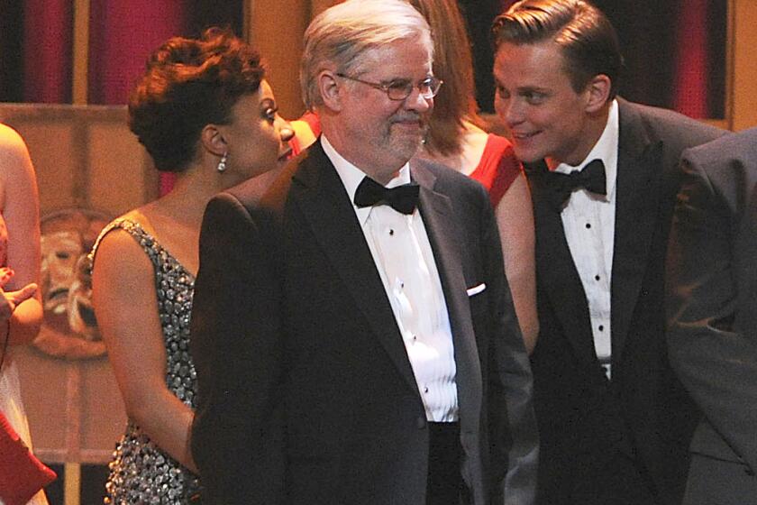 FILE - Playwright Christopher Durang appears on stage with producers to accept the award for best play for "Vanya and Sonia and Masha and Spike" at the 67th Annual Tony Awards, on June 9, 2013 in New York. Also on stage are actors, background from left, Shalita Grant, Kristine Nielsen and Billy Magnussen. Durang died Tuesday, April 2, 2024, at his home in Pipersville, Pennsylvania, of complications from logopenic primary progressive aphasia. He was 75. (Photo by Evan Agostini/Invision/AP, File)