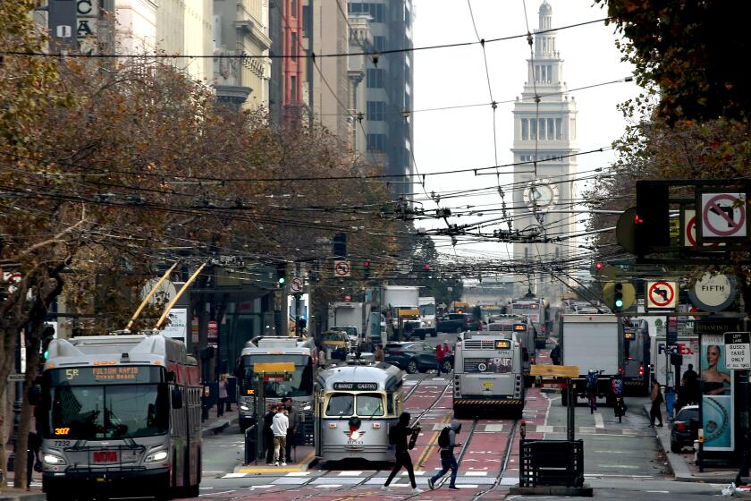 San Francisco, CA - Traffic stream along Market Street in downtwon San Francisco near the Ferry Building and Embarcadero. Steeped in history, culture and financial and natural wealth, San Francisco attracts millions of visitors annually. However, the city by the bay now has a dubious reputation for intractable homelessness, rampant crime and an exodus of business. (Luis Sinco / Los Angeles Times)