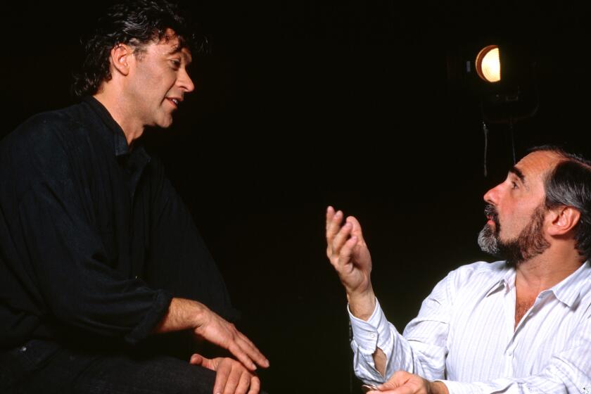 Rock musician Robbie Robertson talks with director Martin Scorsese. (Photo by Lynn Goldsmith/Corbis/VCG via Getty Images)