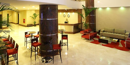 Lobby with chairs, sofa and front desk