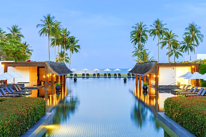 Tropical resort outdoor swimming pool and lounge area