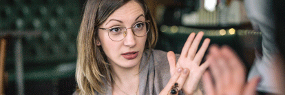 Photo of woman doing sign language