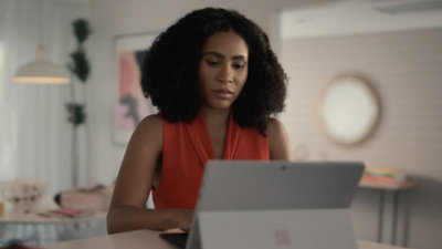 A girl looking at a computer