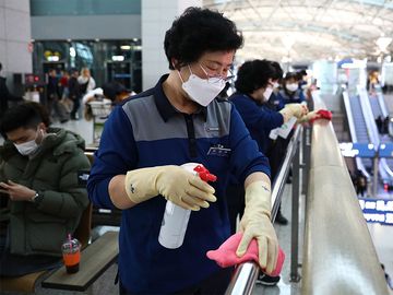 Coronavirus - Disinfection workers wearing masks spray anti-septic solution at the Incheon International Airport on January 27, 2020 in Incheon, South Korea. COVID-19 Epidemic pandemic