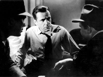 Humphrey Bogart (center) with Ward Bond and Barton MacLane in the motion picture film "The Maltese Falcon"; directed by John Huston (1941).