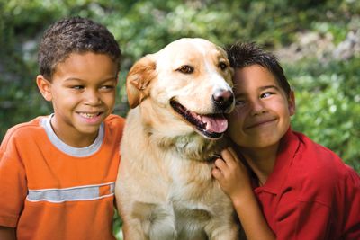 children with a pet dog