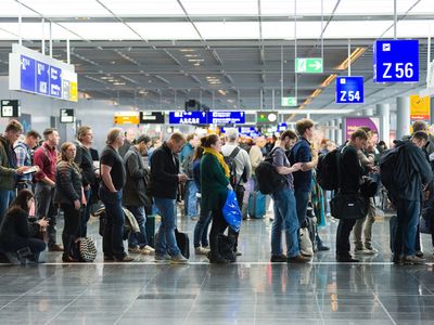 Passengers waiting in a row for boarding on an airport to a flight to America