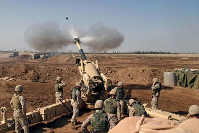 US Marines firing at Fallujah, Iraq, during the Second Battle of Fallujah in November 2004. Operation Iraqi Freedom, Iraq War.