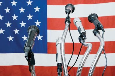 Microphones in front of American flag. Hompepage blog 2009, arts and entertainment, history and society, media news television, crowd opinion protest