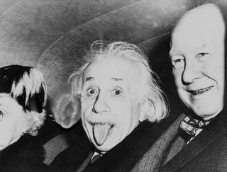 Albert Einstein sticking out his tongue at the photographer.