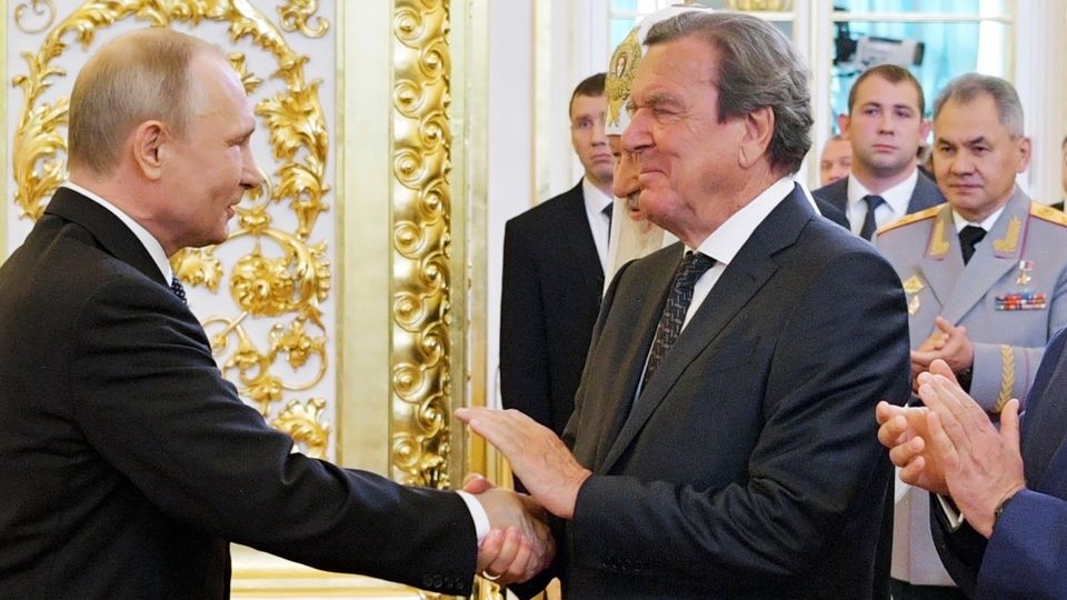 Business partners Vladimir Putin and Gerhard Schröder in a 2018 archive photo